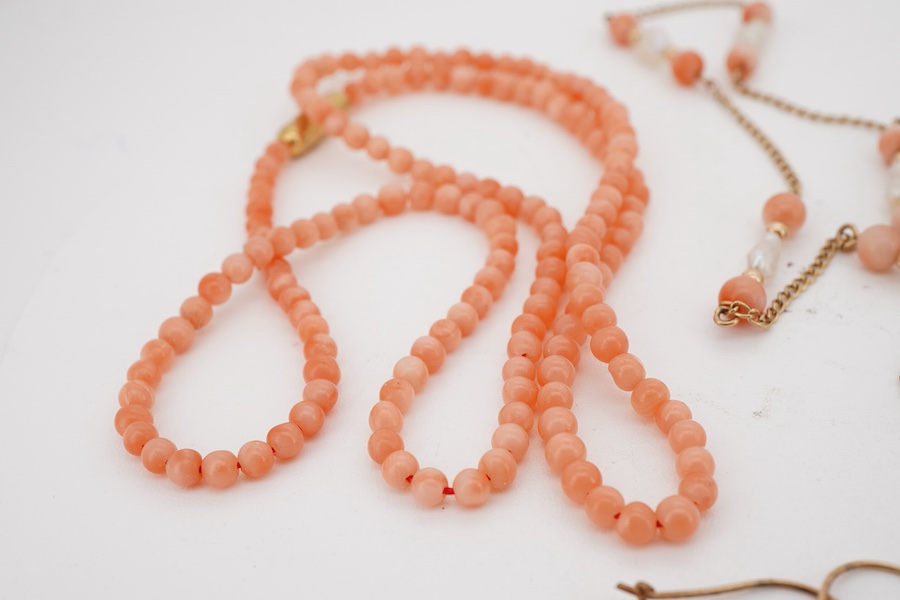 A suite of modern 9ct gold, coral and baroque pearl set jewellery, comprising a necklace, 38cm, a bracelet, 16cm and a pair of drop earrings, together with one other coral bead necklace.